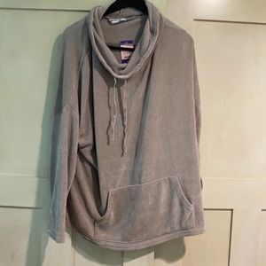 Light pink sweater with tags on it